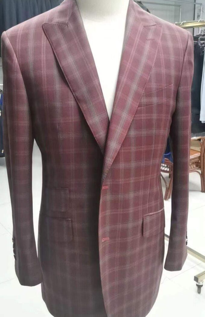 Bespoke maroon checked men’s suit jacket on a mannequin, handcrafted by Alberto Ricci Tailoring in Forres, Scotland.