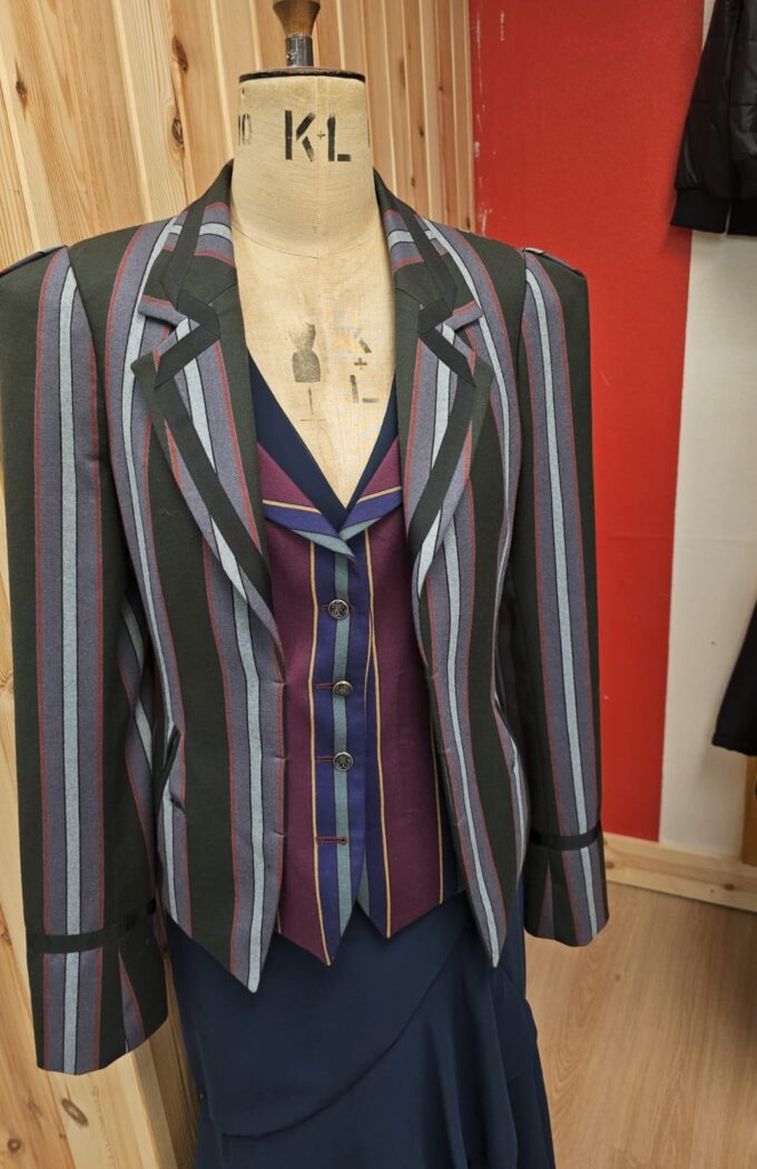 Custom women’s striped tailored suit with matching waistcoat, handmade by Alberto Ricci Tailoring.